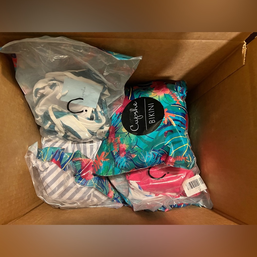 Box of Cupshe swimsuits